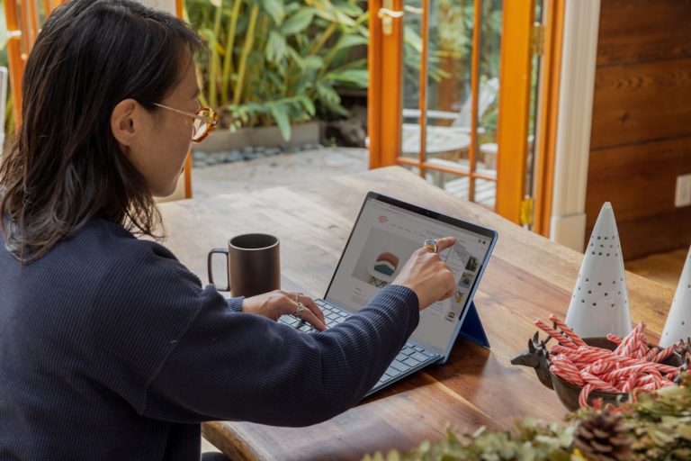 Professional using opportunity management for business software and placing a finger on a touchscreen computer